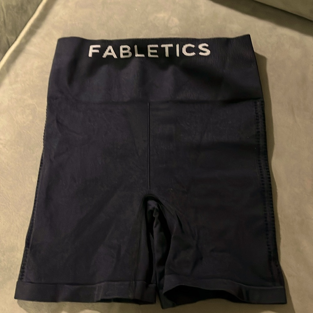 Fabletics small black shorts with small cutouts on sides and bottoms back